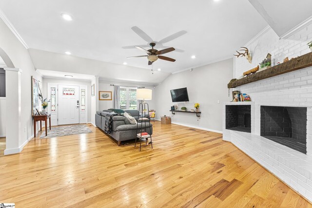 700 Old Green Pond Rd, Anderson, SC 29625 - living room featuring ceiling fan, light wood-type flooring, crown molding, arched walkways, and baseboards