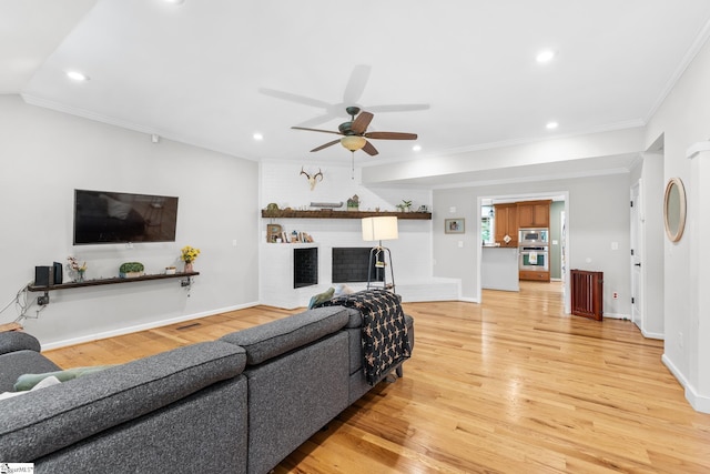 700 Old Green Pond Rd, Anderson, SC 29625 - living room with light wood finished floors, recessed lighting, a ceiling fan, a brick fireplace, and ornamental molding