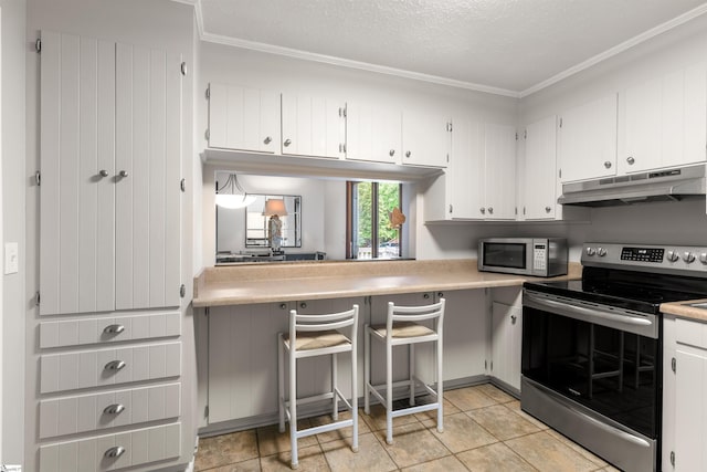 65 Westview Ave, Greenville, SC 29607 - kitchen featuring stainless steel appliances, under cabinet range hood, crown molding, light countertops, and white cabinets