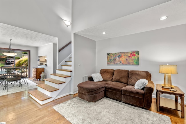 65 Westview Ave, Greenville, SC 29607 - living area featuring wood finished floors, stairway, recessed lighting, and baseboards