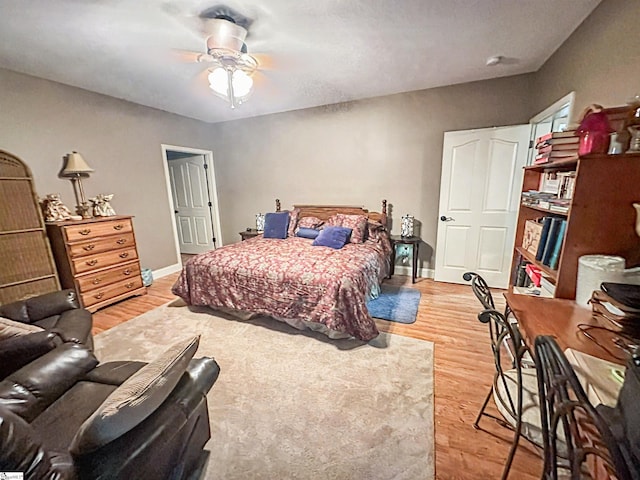586 Silver Shoals Cir, Marietta, SC 29661 - bedroom with light wood finished floors, ceiling fan, and baseboards