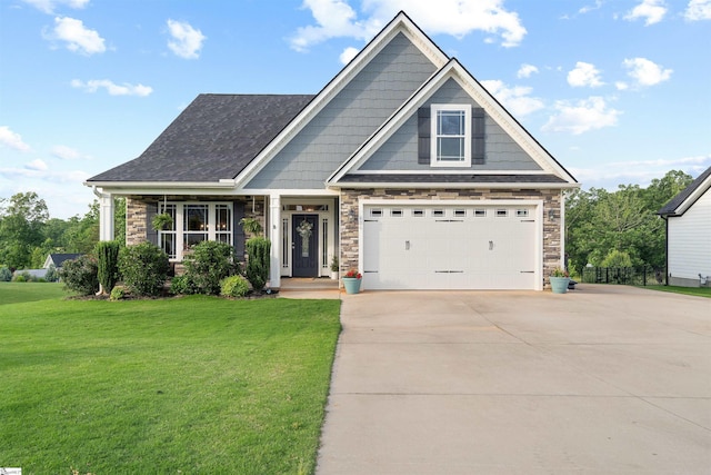 406 Jersey Queen Trl, Greer, SC 29651 - craftsman-style house featuring concrete driveway, stone siding, a front lawn, and a shingled roof