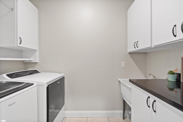 406 Jersey Queen Trl, Greer, SC 29651 - washroom with cabinet space, washing machine and dryer, baseboards, and light tile patterned floors