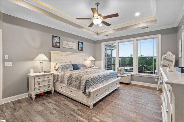 406 Jersey Queen Trl, Greer, SC 29651 - bedroom with a raised ceiling, crown molding, baseboards, wood finished floors, and recessed lighting
