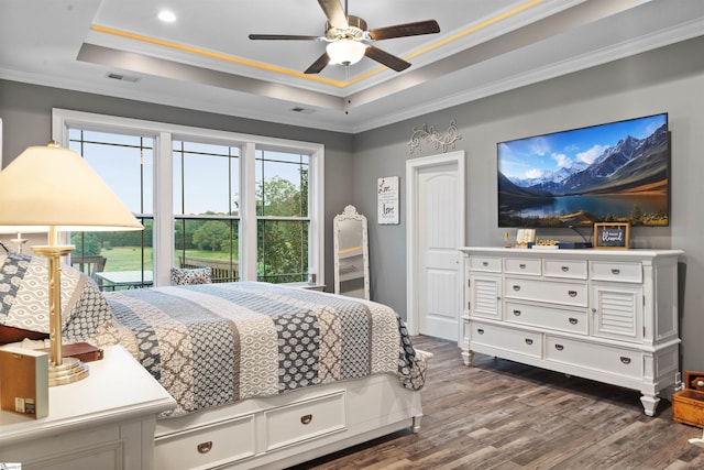 406 Jersey Queen Trl, Greer, SC 29651 - bedroom with a raised ceiling, dark wood-style flooring, crown molding, ceiling fan, and recessed lighting