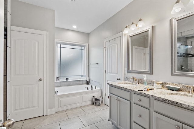 406 Jersey Queen Trl, Greer, SC 29651 - bathroom featuring double vanity, a garden tub, tile patterned floors, and tiled shower