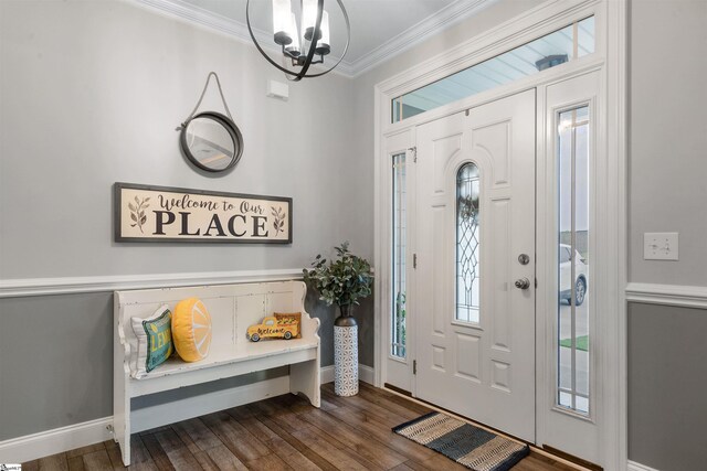 406 Jersey Queen Trl, Greer, SC 29651 - entrance foyer with ornamental molding, a chandelier, dark wood-type flooring, and baseboards