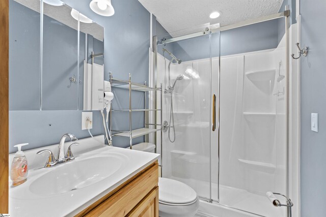 12 Fowler Cir, Greenville, SC 29607 - bathroom with a stall shower, toilet, vanity, and a textured ceiling