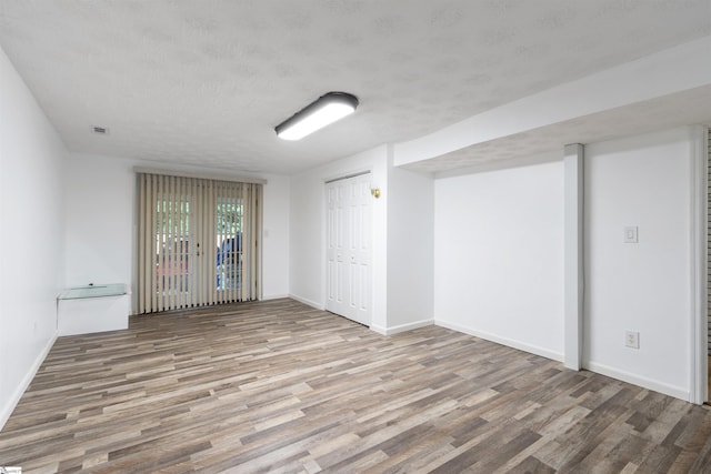 12 Fowler Cir, Greenville, SC 29607 - empty room featuring wood finished floors, baseboards, and a textured ceiling