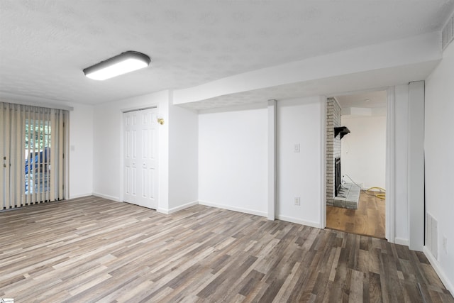 12 Fowler Cir, Greenville, SC 29607 - basement featuring wood finished floors, baseboards, and a textured ceiling