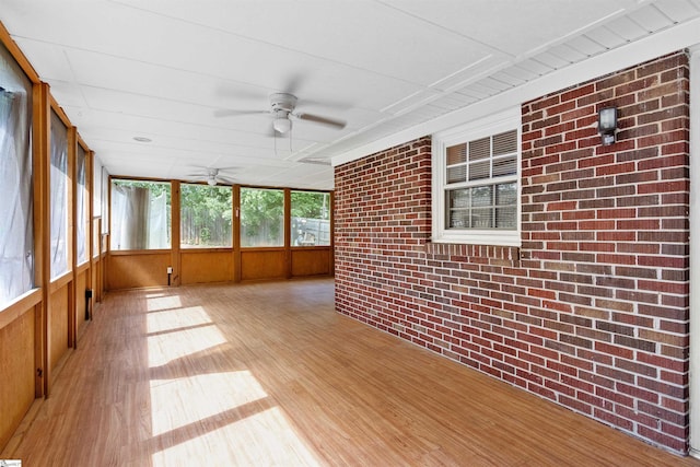 12 Fowler Cir, Greenville, SC 29607 - unfurnished sunroom featuring wooden walls, wood finished floors, and brick wall
