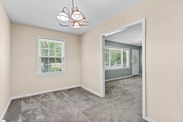 12 Fowler Cir, Greenville, SC 29607 - carpeted spare room with a chandelier, plenty of natural light, baseboards, and a textured ceiling