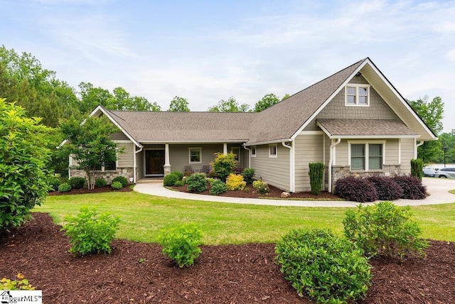 5 Maxfli Ct, Greenville, SC 29690 - craftsman-style home featuring stone siding, a front yard, and roof with shingles