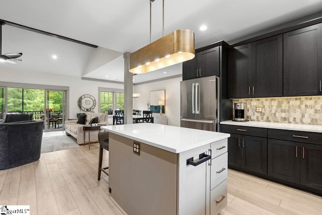 5 Maxfli Ct, Greenville, SC 29690 - kitchen with freestanding refrigerator, open floor plan, light wood-style flooring, light countertops, and a kitchen island