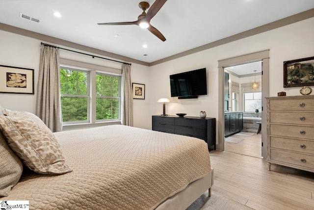 5 Maxfli Ct, Greenville, SC 29690 - bedroom with light wood finished floors, multiple windows, ensuite bath, recessed lighting, and a ceiling fan