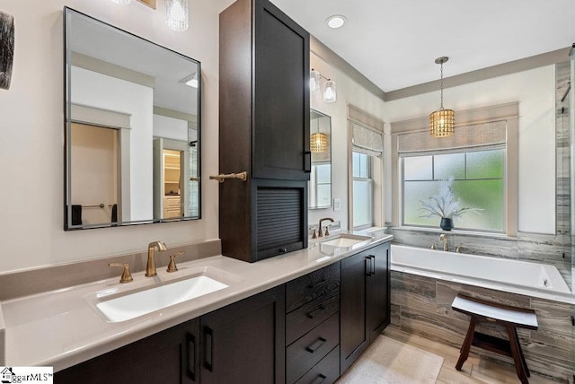 5 Maxfli Ct, Greenville, SC 29690 - bathroom with a bath and double vanity