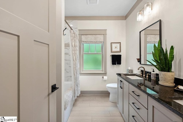 5 Maxfli Ct, Greenville, SC 29690 - bathroom featuring toilet, double vanity, wood finished floors, and baseboards