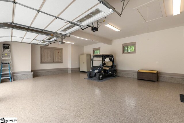 5 Maxfli Ct, Greenville, SC 29690 - garage featuring a garage door opener and baseboards