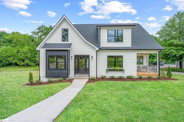 710 N Main St, Greer, SC 29651 - view of front facade with roof with shingles, a front yard, and a porch
