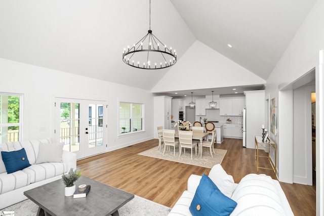 710 N Main St, Greer, SC 29651 - living room featuring high vaulted ceiling, a chandelier, wood finished floors, and french doors