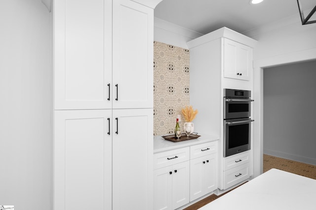 710 N Main St, Greer, SC 29651 - kitchen featuring stainless steel double oven, light countertops, white cabinets, and recessed lighting