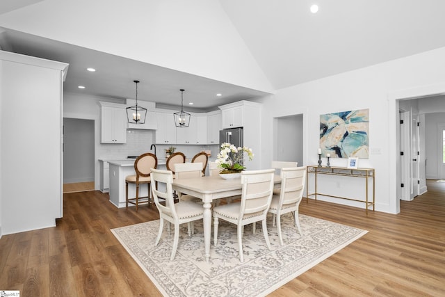 710 N Main St, Greer, SC 29651 - dining room featuring wood finished floors, recessed lighting, vaulted ceiling, and baseboards
