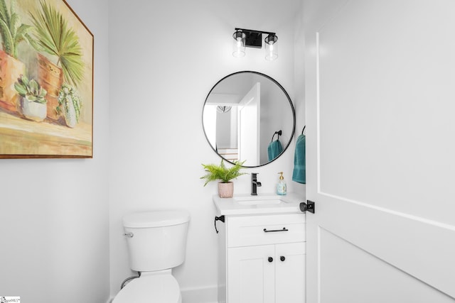 710 N Main St, Greer, SC 29651 - half bathroom featuring toilet, vanity, and baseboards