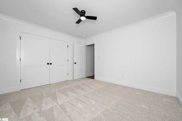 710 N Main St, Greer, SC 29651 - unfurnished bedroom featuring crown molding, carpet, baseboards, a closet, and ceiling fan
