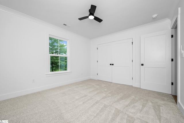 710 N Main St, Greer, SC 29651 - unfurnished bedroom featuring ornamental molding, carpet flooring, baseboards, a ceiling fan, and a closet