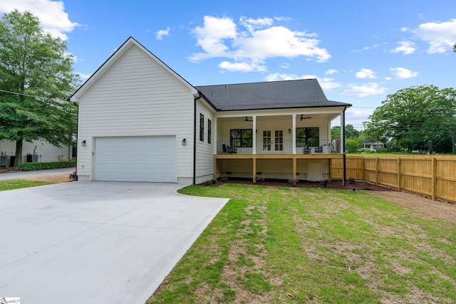 710 N Main St, Greer, SC 29651 - rear view of property featuring a ceiling fan, concrete driveway, roof with shingles, and french doors