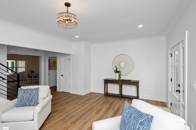710 N Main St, Greer, SC 29651 - living area featuring crown molding, stairway, a chandelier, wood finished floors, and recessed lighting