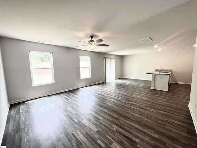 618 Farmstead Trl, Inman, SC 29349 - unfurnished living room featuring dark wood finished floors, baseboards, and a ceiling fan
