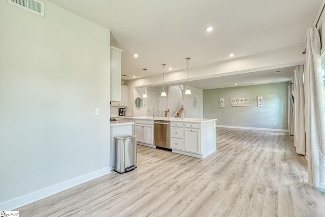 1128 Grovewood Ct, Moore, SC 29369 - kitchen featuring dishwasher, light wood finished floors, light countertops, a sink, and open floor plan