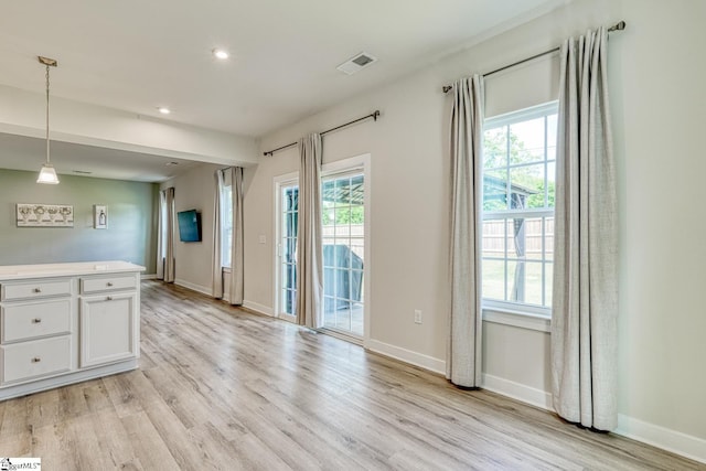 1128 Grovewood Ct, Moore, SC 29369 - kitchen featuring white cabinets, light wood-type flooring, plenty of natural light, and recessed lighting