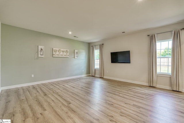 1128 Grovewood Ct, Moore, SC 29369 - unfurnished living room with healthy amount of natural light, light wood-style floors, recessed lighting, and baseboards