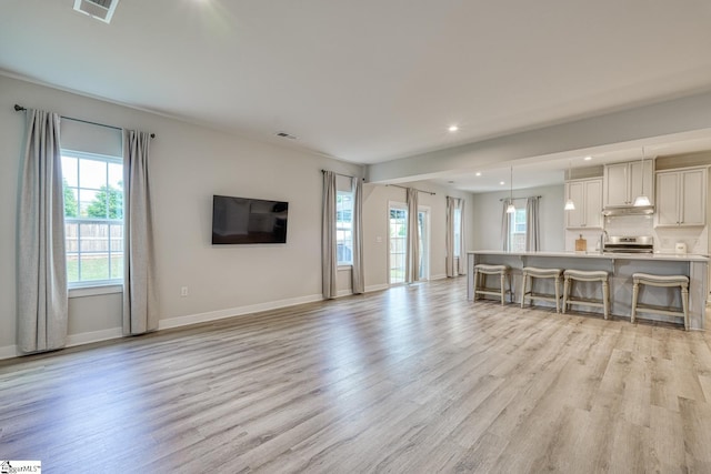 1128 Grovewood Ct, Moore, SC 29369 - living area featuring light wood finished floors, baseboards, and recessed lighting