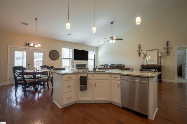 250 Chickadee Trl, Easley, SC 29642 - kitchen featuring dishwasher, open floor plan, a sink, dark wood-style floors, and light stone counters