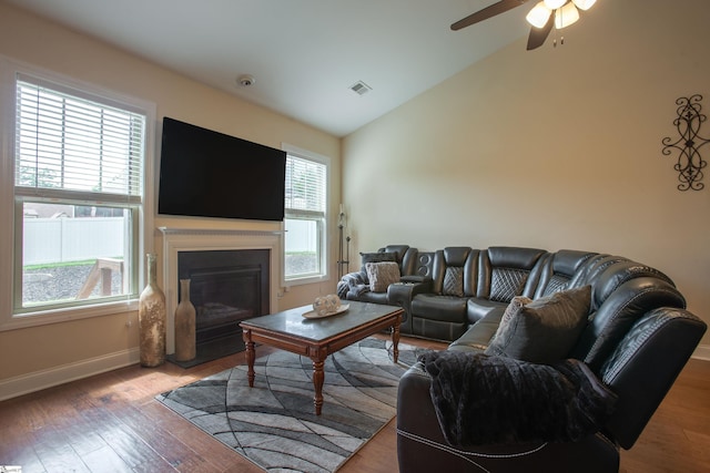 250 Chickadee Trl, Easley, SC 29642 - living room with lofted ceiling, baseboards, ceiling fan, a glass covered fireplace, and wood finished floors