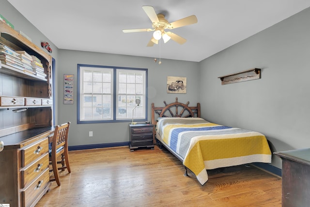 bedroom featuring light wood-style flooring, baseboards, and ceiling fan