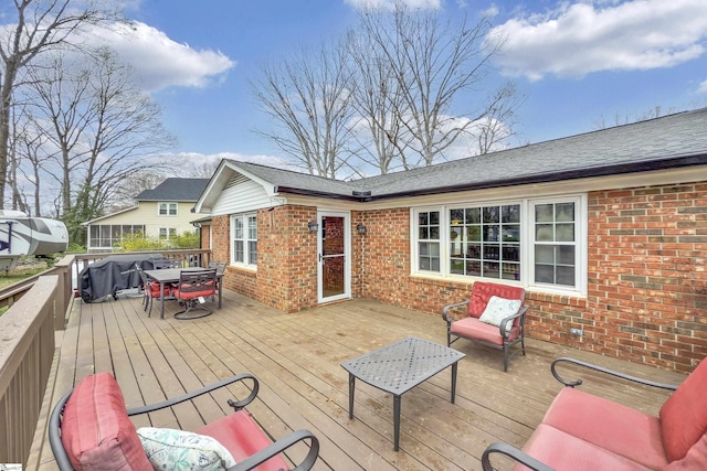 wooden terrace featuring outdoor dining area