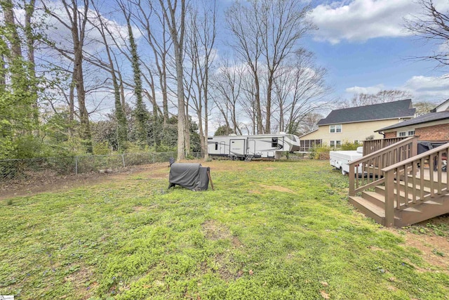 view of yard featuring a wooden deck
