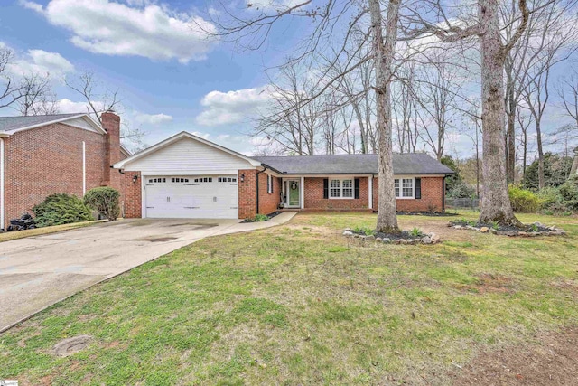 ranch-style house featuring brick siding, a garage, driveway, and a front lawn