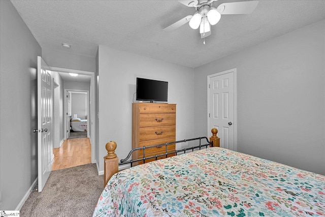 205 Willow Leaf Dr, Seneca, SC 29672 - carpeted bedroom featuring baseboards, a textured ceiling, and a ceiling fan