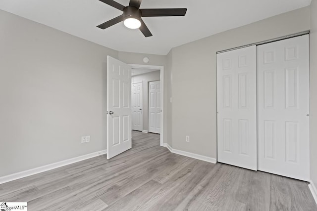 338 E Celestial Dr, Greer, SC 29651 - unfurnished bedroom with light wood finished floors, a closet, baseboards, and ceiling fan