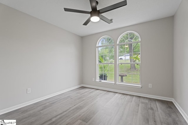 338 E Celestial Dr, Greer, SC 29651 - unfurnished room featuring wood finished floors, ceiling fan, and baseboards