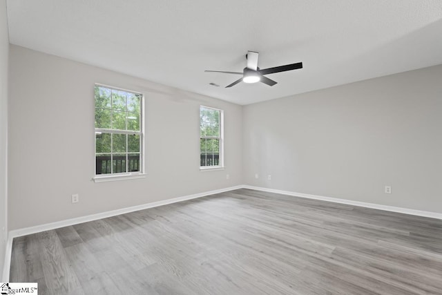 338 E Celestial Dr, Greer, SC 29651 - unfurnished room featuring wood finished floors, a ceiling fan, and baseboards