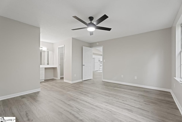 338 E Celestial Dr, Greer, SC 29651 - unfurnished living room with ceiling fan, wood finished floors, and baseboards
