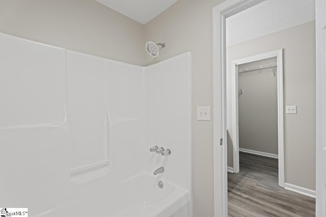 338 E Celestial Dr, Greer, SC 29651 - full bath with bathtub / shower combination, wood finished floors, and baseboards
