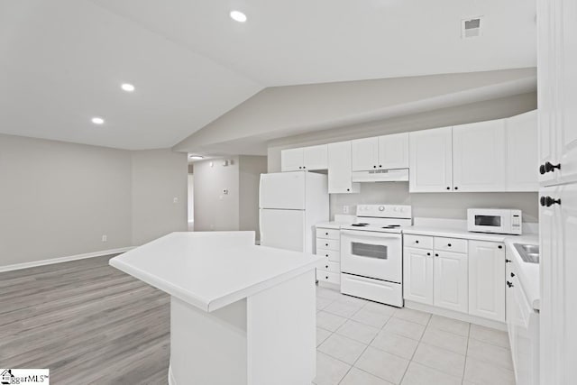 338 E Celestial Dr, Greer, SC 29651 - kitchen with white appliances, under cabinet range hood, light countertops, vaulted ceiling, and a center island