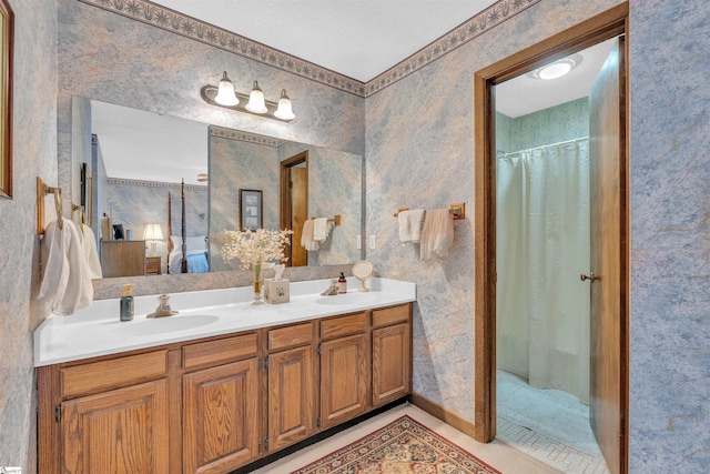 122 Tanager Cir, Greer, SC 29650 - ensuite bathroom with double vanity, wallpapered walls, and a shower with curtain